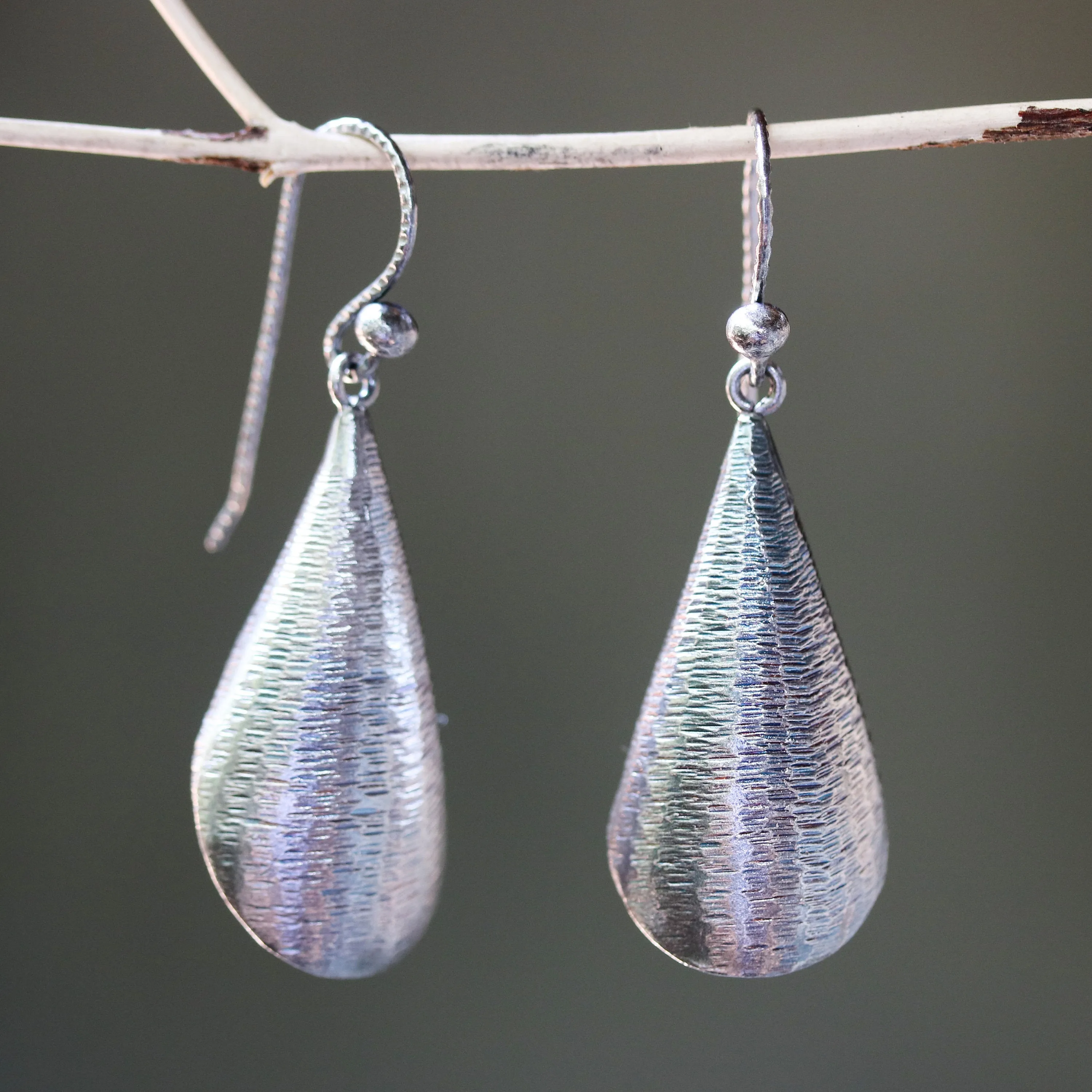 Silver leaf shape earrings with textured on oxidized sterling silver hooks style