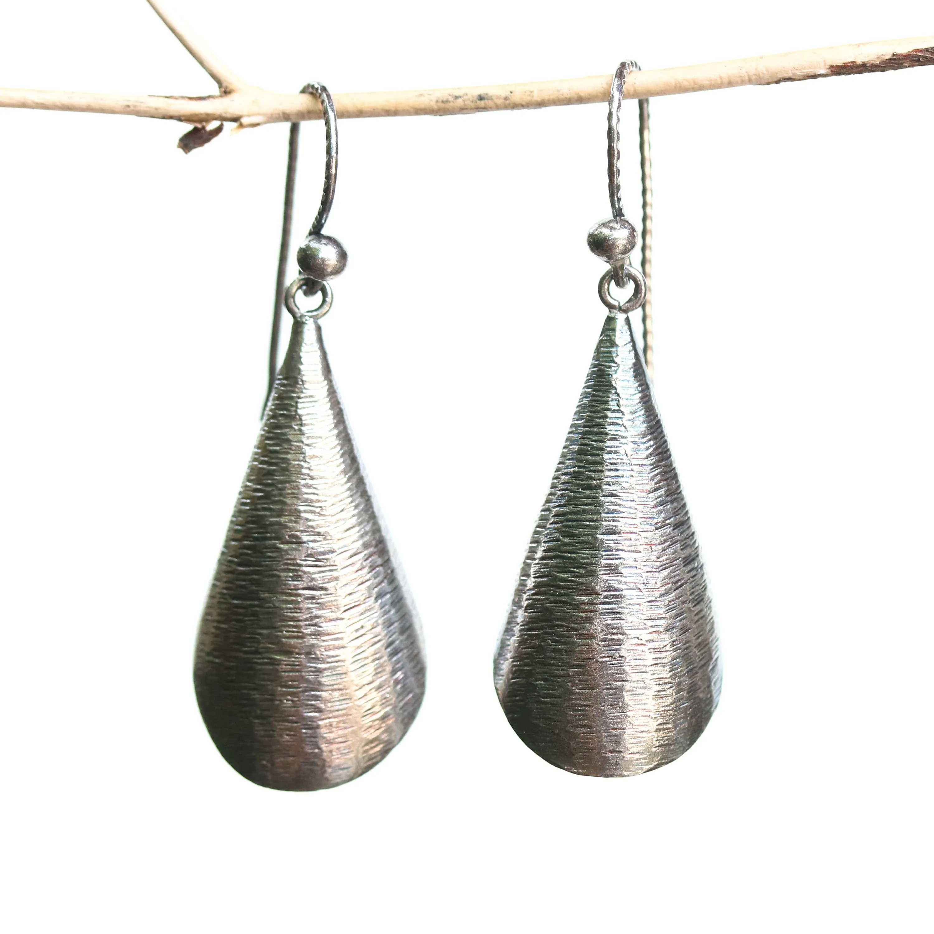 Silver leaf shape earrings with textured on oxidized sterling silver hooks style