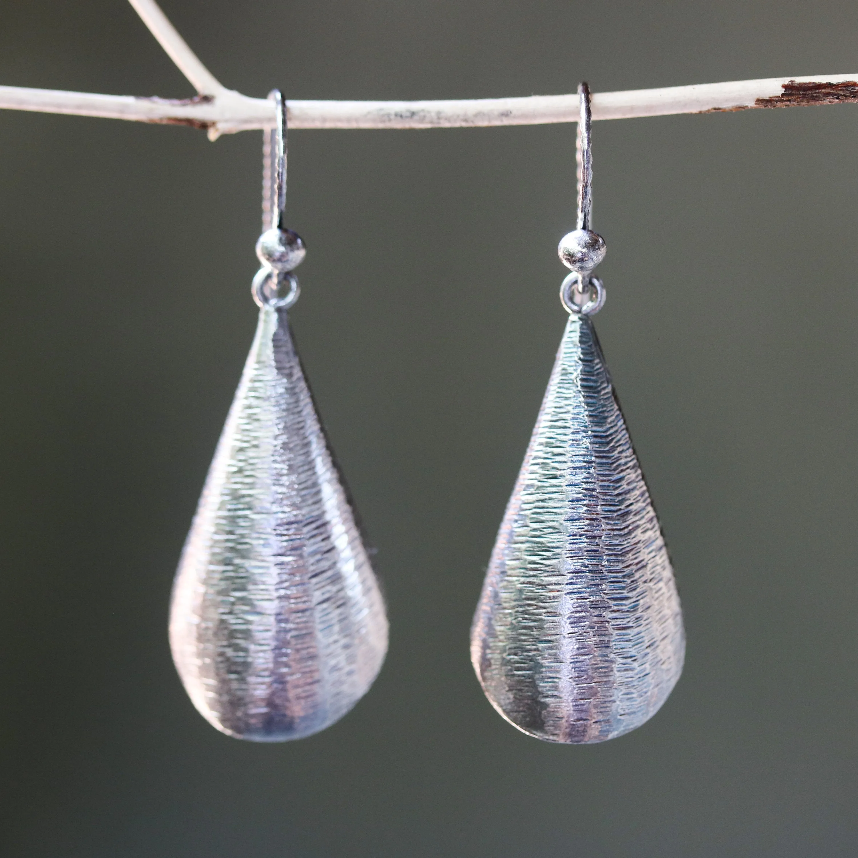 Silver leaf shape earrings with textured on oxidized sterling silver hooks style