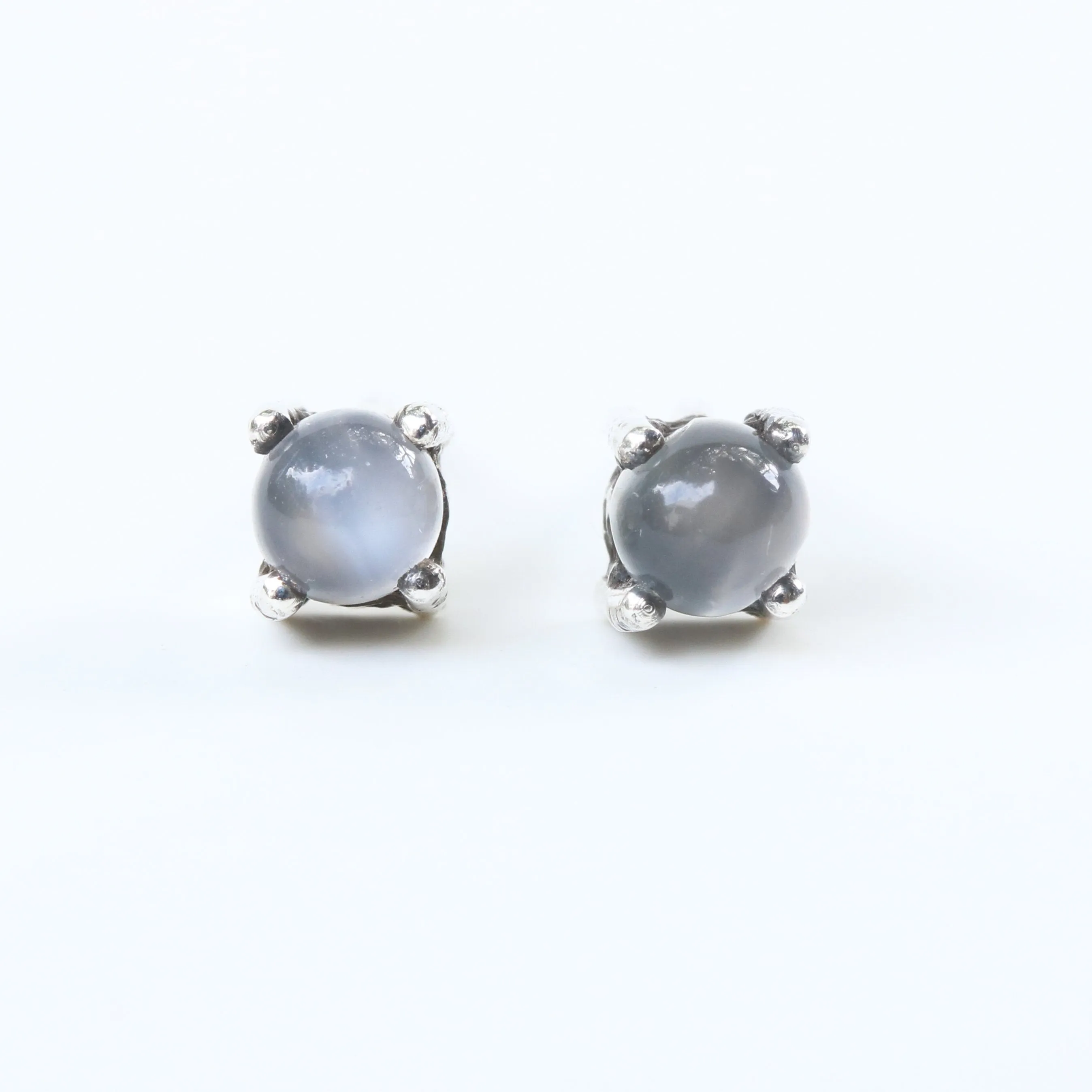 Sterling silver stud earrings with cabochon white moonstone in prongs setting with sterling silver post and backing