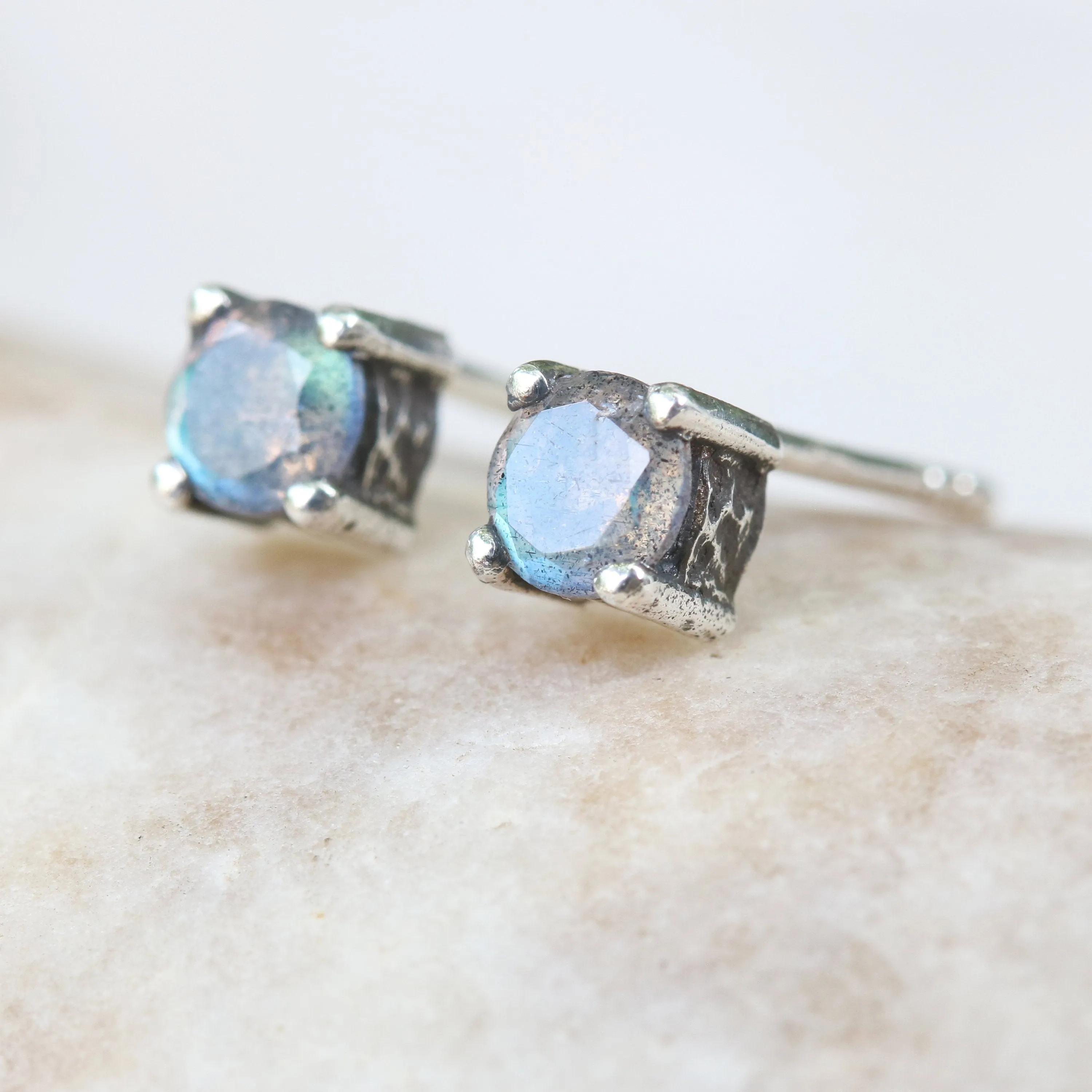 Sterling silver stud earrings with faceted labradorite in prongs setting with sterling silver post and backing