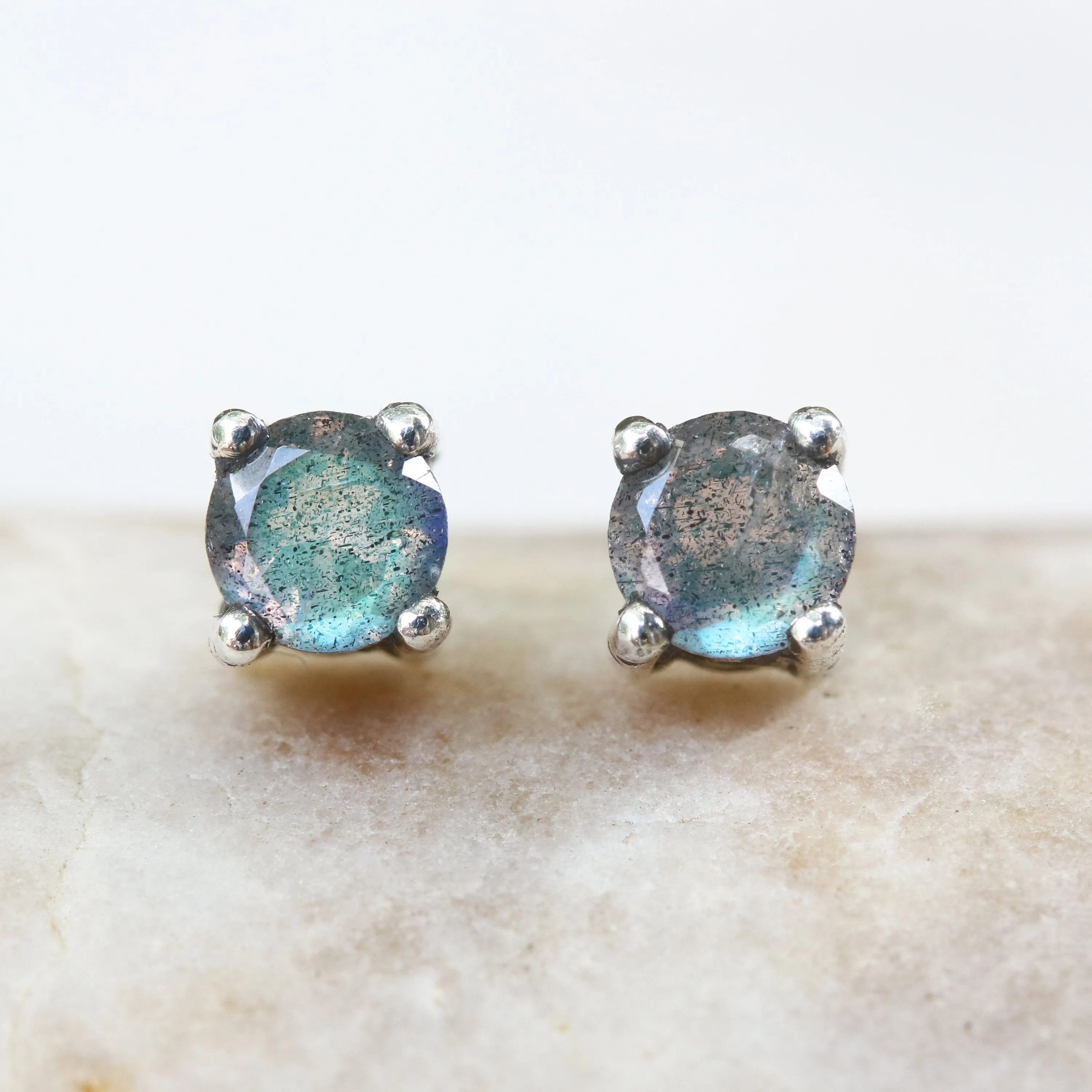Sterling silver stud earrings with faceted labradorite in prongs setting with sterling silver post and backing