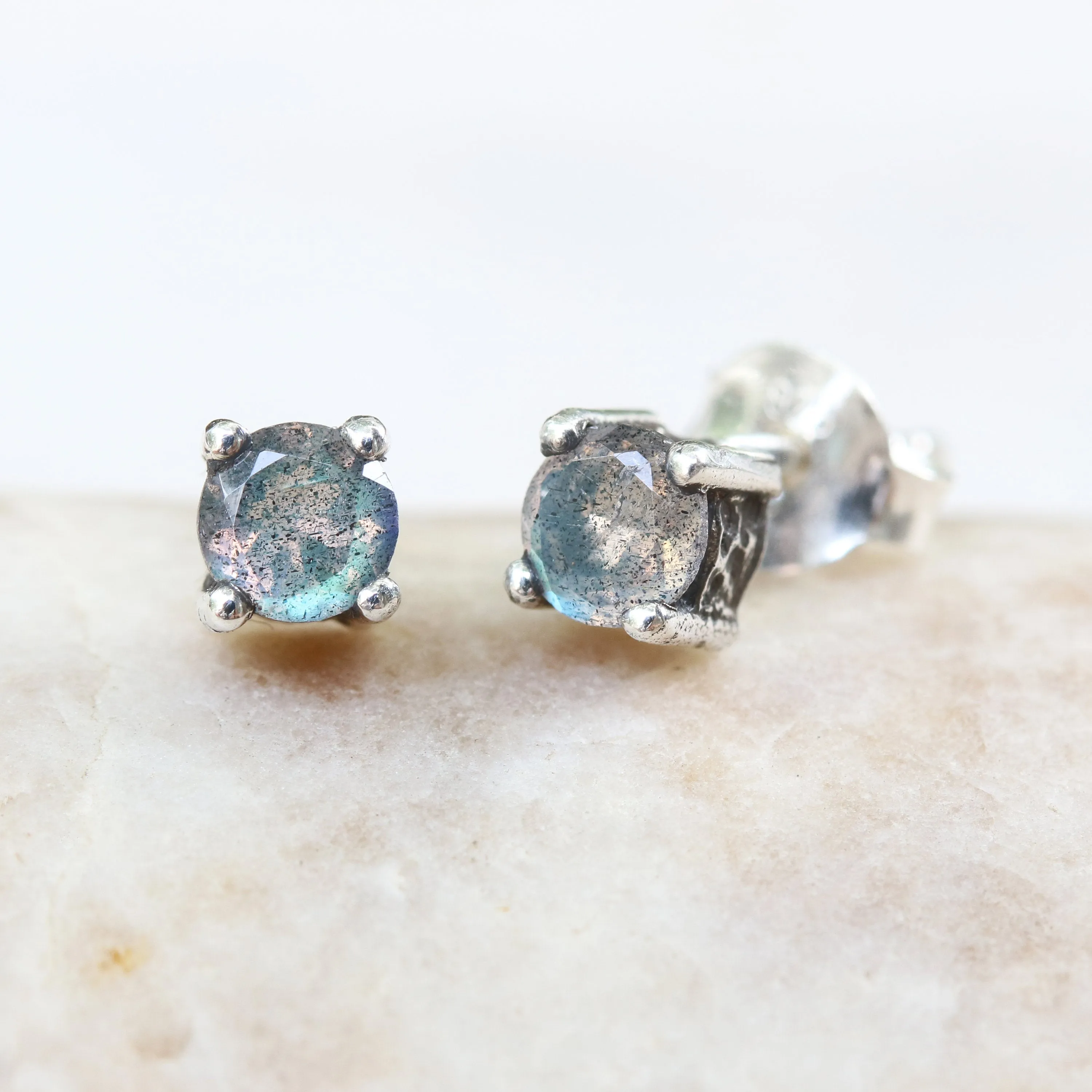 Sterling silver stud earrings with faceted labradorite in prongs setting with sterling silver post and backing